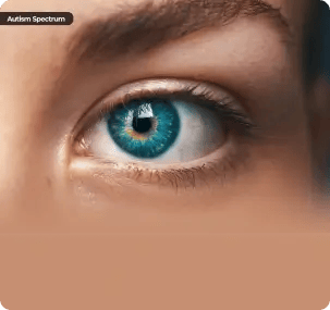 A vertical close-up of a blue human eye with an "Autism Spectrum" label in the top left corner, symbolizing the specialized psychological insight and emotional clarity gained through tailored counselling services for neurodivergent individuals.