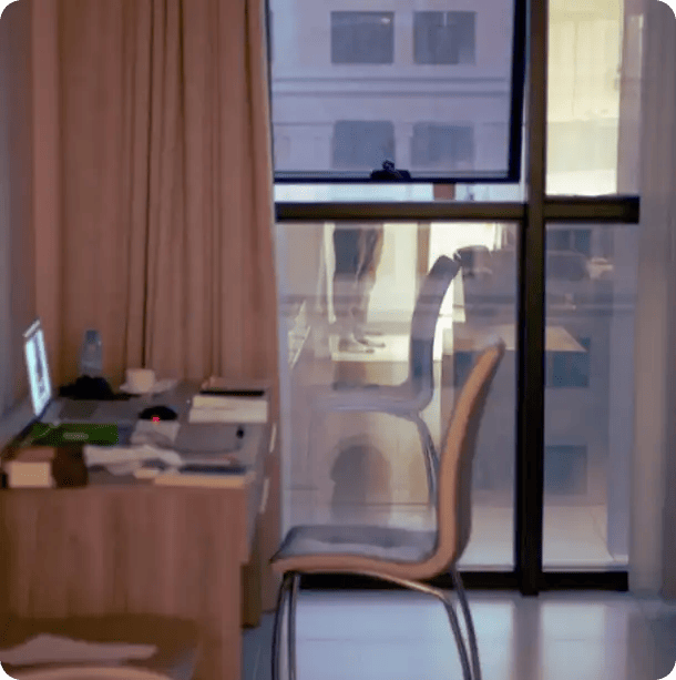 A clean, organized home office desk with a laptop and notebook, symbolizing the professional NDIS plan management and coordination services provided by Jango Community Services.