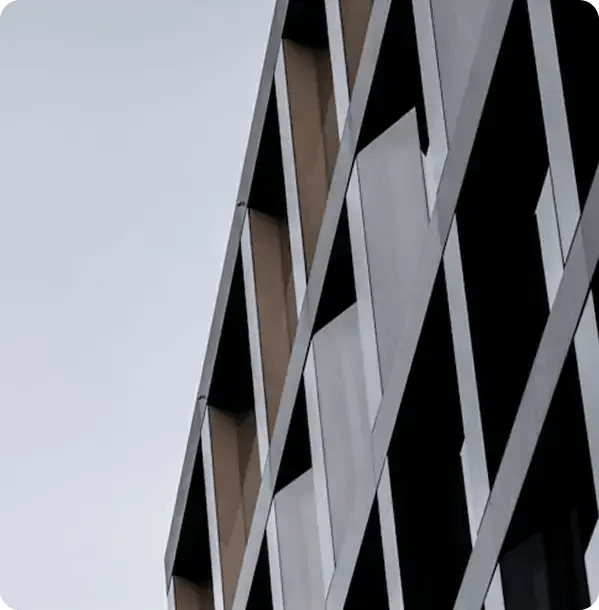 An architectural view of a modern apartment building, symbolizing the high-quality supported independent living (SIL) housing where Jango provides gardening and maintenance services.